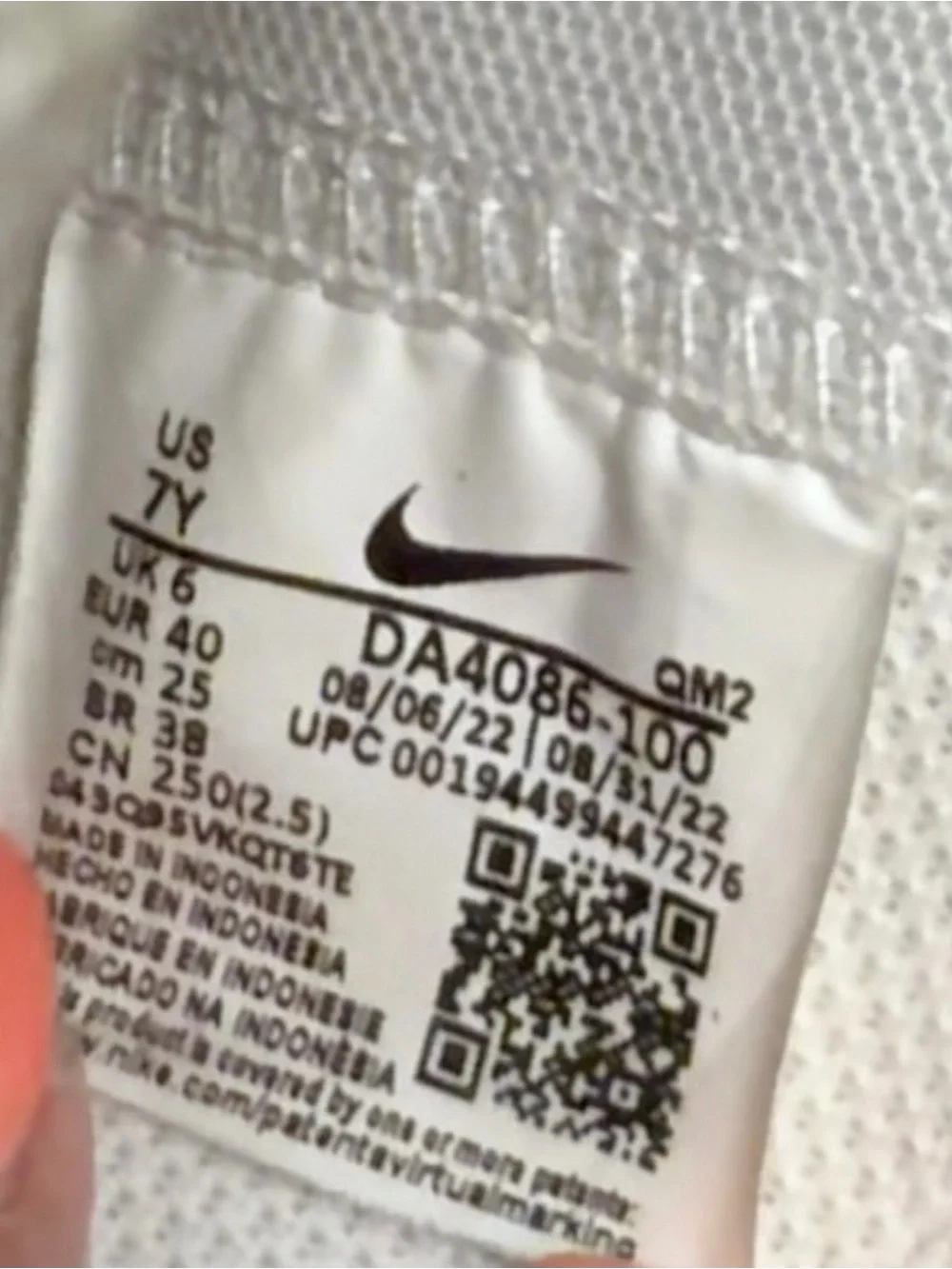 Nike White High-Top Sneakers with Black Swoosh